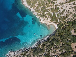 Aerial view of Potocnica, Lun and Novalja in island of Pag, archipelago of Croatia. Panoramic drone view of waterfront, idyllic and turquoise sea in Novalja, Adriatic Sea in Dalmatia region.
