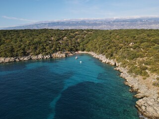 Aerial view of Potocnica, Lun and Novalja in island of Pag, archipelago of Croatia. Panoramic drone view of waterfront, idyllic and turquoise sea in Novalja, Adriatic Sea in Dalmatia region.
