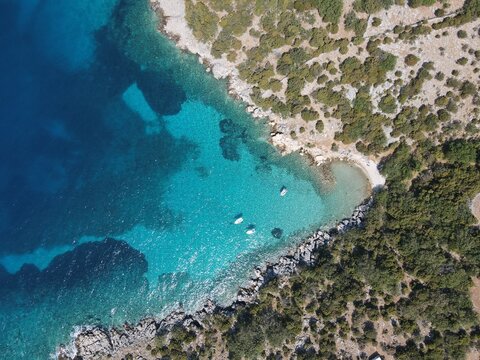 Aerial view of Potocnica, Lun and Novalja in island of Pag, archipelago of Croatia. Panoramic drone view of waterfront, idyllic and turquoise sea in Novalja, Adriatic Sea in Dalmatia region.

