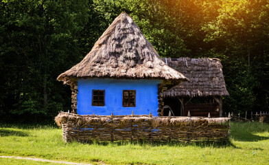 Old wooden house or windmill in autumn light
