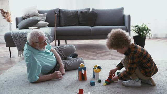 Grandparents and grandson playing at home	