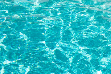 turquoise color background of swimming pool water with ripples in malibu