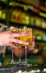 man hand bartender making cocktail glass in bar