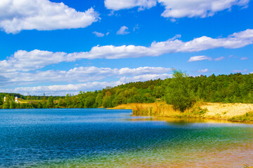 Obraz na płótnie Canvas Beautiful quarry lake dredging pond lake blue turquoise water Germany.