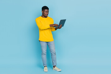 Full size photo of boss millennial brunet guy look laptop wear smart casual isolated on blue background