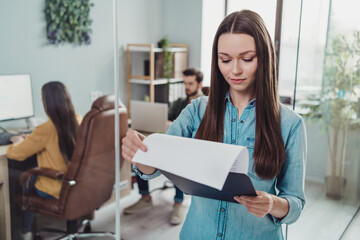 Portrait of group employees coworking executive director read clipboard paperwork startup development indoors