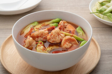Hot and spicy sour soup with Katuri Flower with shrimp in white bowl.Thai traditional healthy menu and diet food,Kaeng Som Dok khae