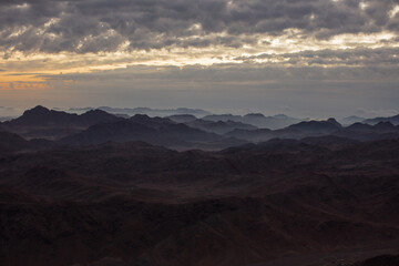 Obraz na płótnie Canvas Amazing Sunrise at Sinai Mountain, Mount Moses with a Bedouin, Beautiful view from the mountain