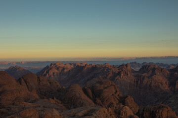 Fototapeta na wymiar Amazing Sunrise at Sinai Mountain, Mount Moses with a Bedouin, Beautiful view from the mountain