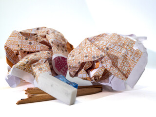 optical pink form of an examination with pencil, close up,the idea of failing the exam,broken pencil and curled paper