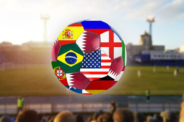 2022 Qatar soccer football ball with countries flags on stadium background