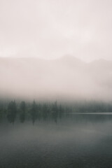 Beautiful mystical landscape of Altai Lake in the fog. Theme of relaxation and zen buddhism. Minimalism concept.