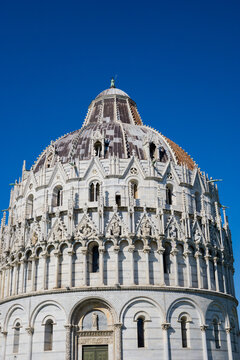 Pisa, Tuscany, Italy 08-28-2022. Details the architecture of the Pisa Baptistery, dedicated to Saint John the Baptist, faces the cathedral at the western end of the Piazza dei Miracoli.