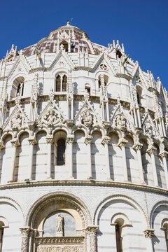 Pisa, Tuscany, Italy 08-28-2022. Details the architecture of the Pisa Baptistery, dedicated to Saint John the Baptist, faces the cathedral at the western end of the Piazza dei Miracoli.