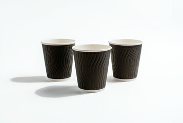 A disposable coffee cup without a lid isolated on a white background