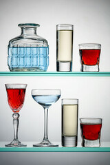 Various alcoholic drinks on glass shelves.