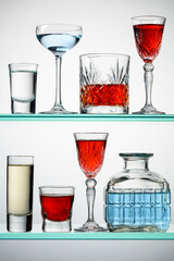 Various alcoholic drinks on glass shelves.