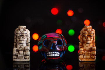 Mexican Dia de muertos skull in traditional altar 