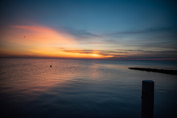 Fototapeta na wymiar Outer Banks Sunset over the ocean, OBX Rodanthe, North Carolina