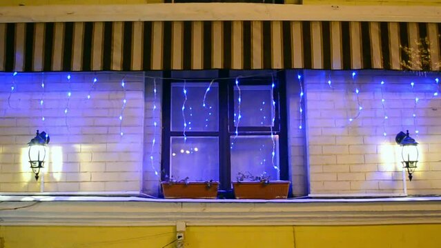 blue led light holiday illumination on the night window, christmas decoration