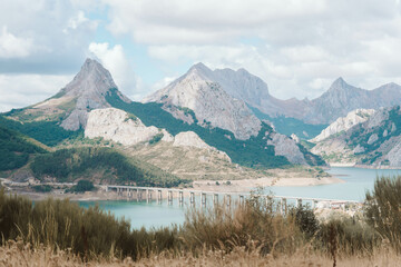 Lake with a brige and the mountains in the background