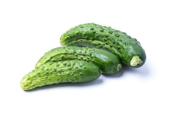 Three juicy green cucumbers, isolate on a white background