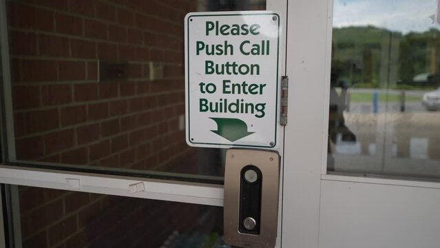 Sign posted at entrance to for their security and safety at school saying that all visitors must report to the office and push button for entrance.