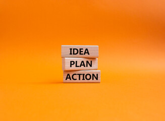 Idea Plan Action symbol. Wooden blocks with words Idea Plan Action. Beautiful orange background. Business and Idea Plan Action concept. Copy space.