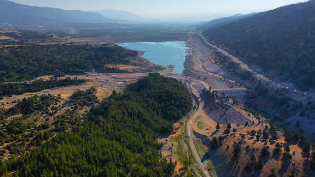 Water level in the Caybogazı Dam on Gombe Plateau in Antalya Kas district dropped to bottom. Unable to give water to two plains due to drought and inadequate precipitation. Fly over Aerial view
