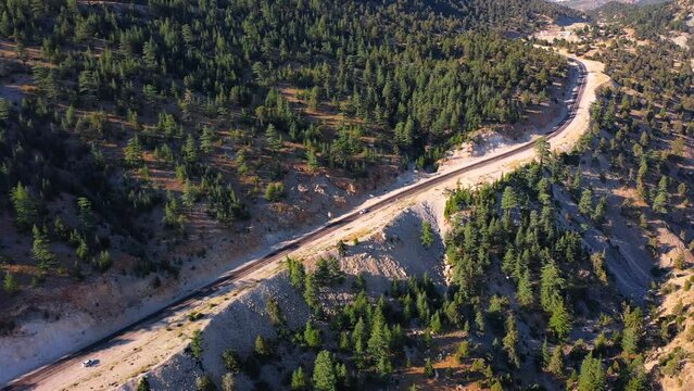 Road to Kas winds up and down hills through a heavily forested region that offers occasional glimpses of the sea. Aerial view at Gombe Plateau, Antalya in the Turkey Country
