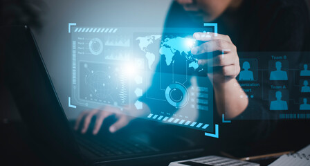 Businessman using a laptop with Analytics and Data Management System on the computer, Hands working on a laptop cloud network graphic overlay, connected to the database. Corporate strategy for finance