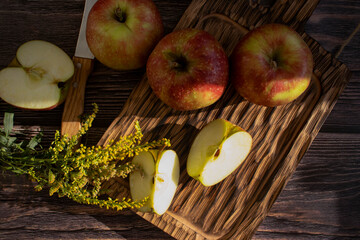 Fresh apples on old background