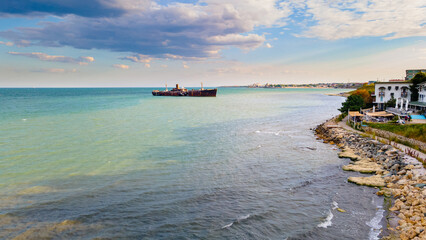 Drone photography of a rusty shipwreck at the Black Sea located next to Costinesti beach, in...