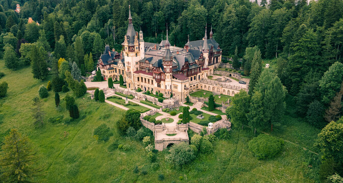 Aerial photography of Peles Castle in Romania. Photography was shot from a drone at a higher altitude with camera pointed downwards towards the castle.