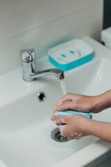 The Girl Washes Her Hands to Avoid Infection With the Virus COVID-19