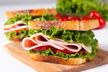 Close-up photo of an American club sandwich. Fast food concept. 