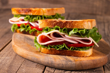 Close-up photo of an American club sandwich. Fast food concept. 