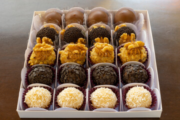 tray of various candy for parties, brigadeiro, coconut, walnut and chocolate candy