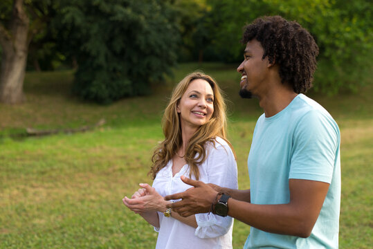 Young Mixed Race Couple Walking In The Summer Nature