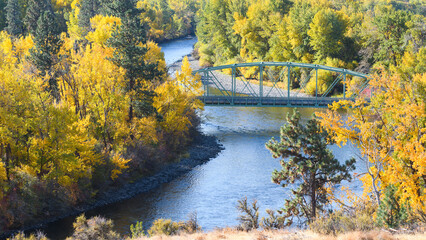 Fall colors surround the North Thorp Highway Bridge and Yakima River in Kittitas County