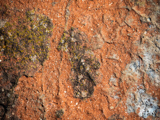 imagen textura piedra con tonos rojos y algunas marcas oscuras