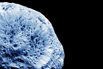 Large asteroid on a dark background. Elements of this image furnished by NASA