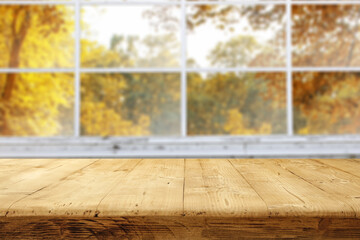 Desk of free space and autumn window. 