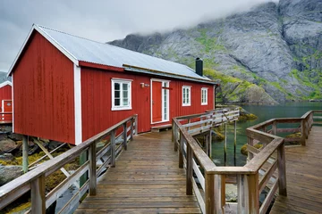 Poster Fishing village with traditional red rorbu in Nusfjord, Lofoten, Norway © Mariusz Świtulski