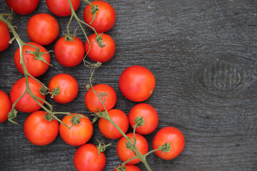 Fototapeta na wymiar Fresh tomatoes on a wooden background