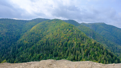 A view of the most beautiful mountains in a panoramic scene. View from Tomasovsky Vyhlad in Slovak Paradise National Park. A blue haze is in the air.