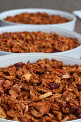 Ready dried apple slices stored in the sacks. Selective focus.