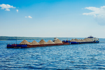 Barges with sand. The barge transports sand along the Volga river.