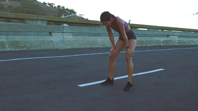 Fitness, tired and street runner in city for workout, routine morning sunrise exercise or sunset training. Healthy sports or marathon woman building running motivation, body wellness or cardio health