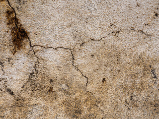Close up of crack in old stone plastered wall